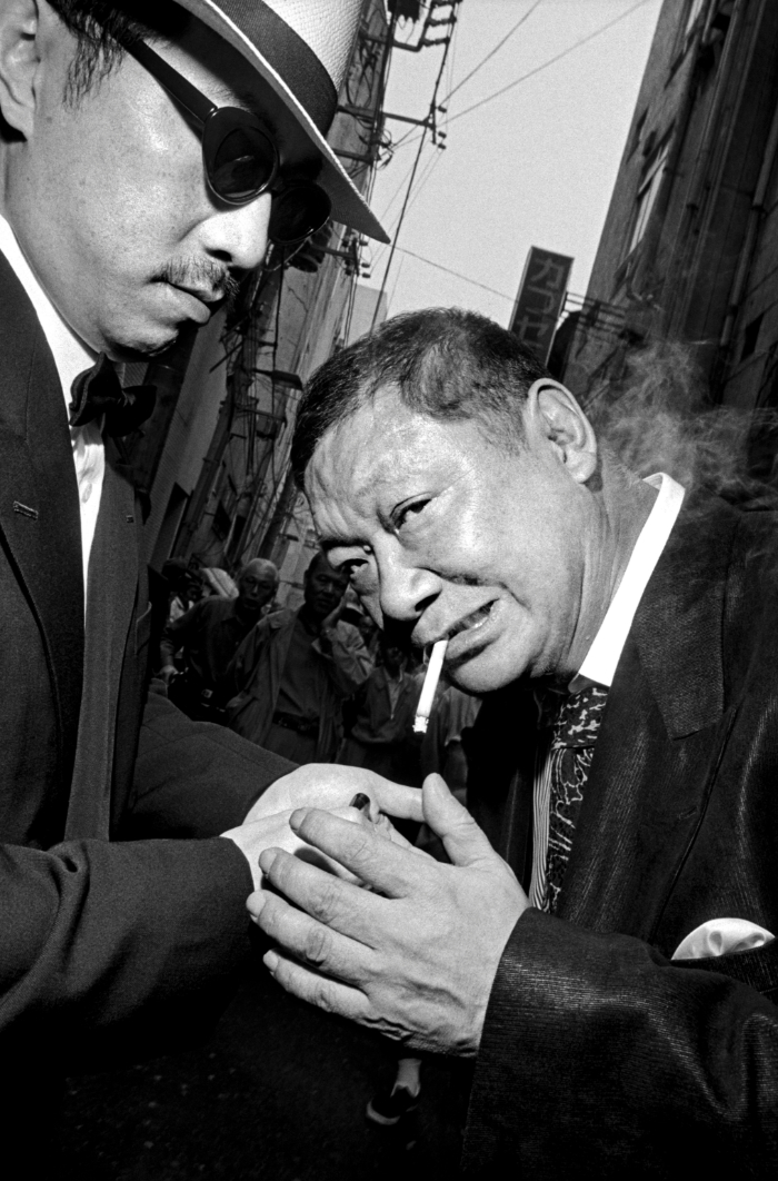 Bruce GildenGeorge Abe on the right, an ex-Yakuza member and celebrity writer, Asakusa, Japan, 1998 © Bruce Gilden / Magnum Photos